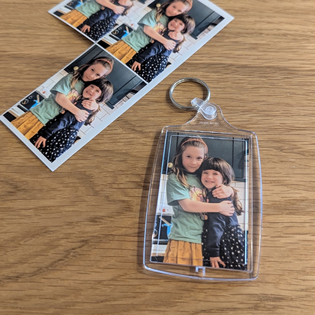 keyring with photo of two daughters