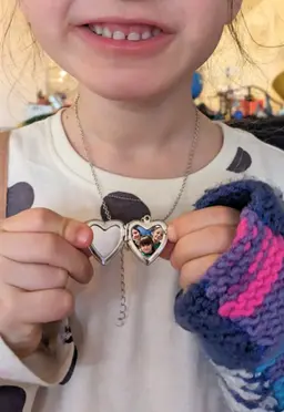 A child with a heart locket