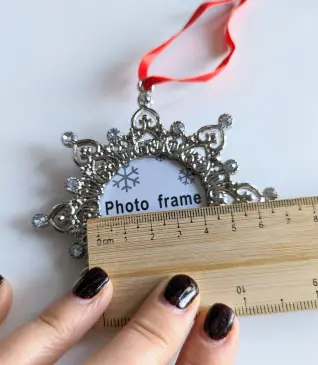 A ruler measuring the width of a frame.
